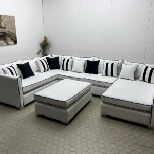 Spacious Ivory U-Shaped Sofa with Black Piping