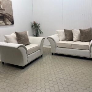 Pair of Cream Sofas with Sculpted Shape and Mixed Cushions