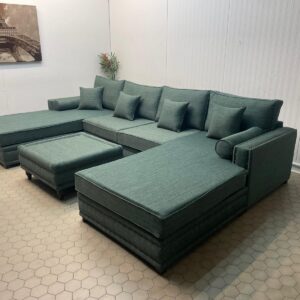 Large Green U-Shaped Sofa with Matching Table